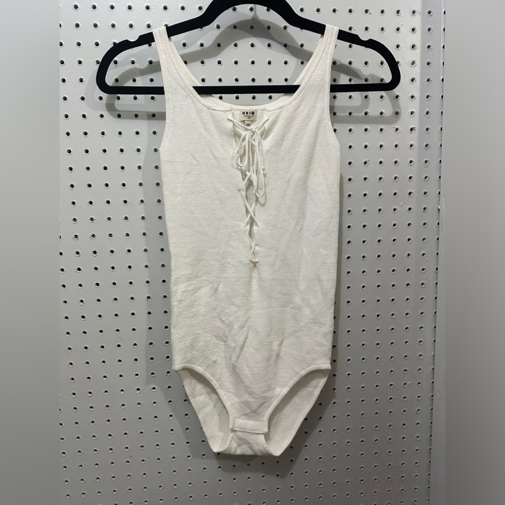 Unio knit bodysuit w/snap closure & lace up top area